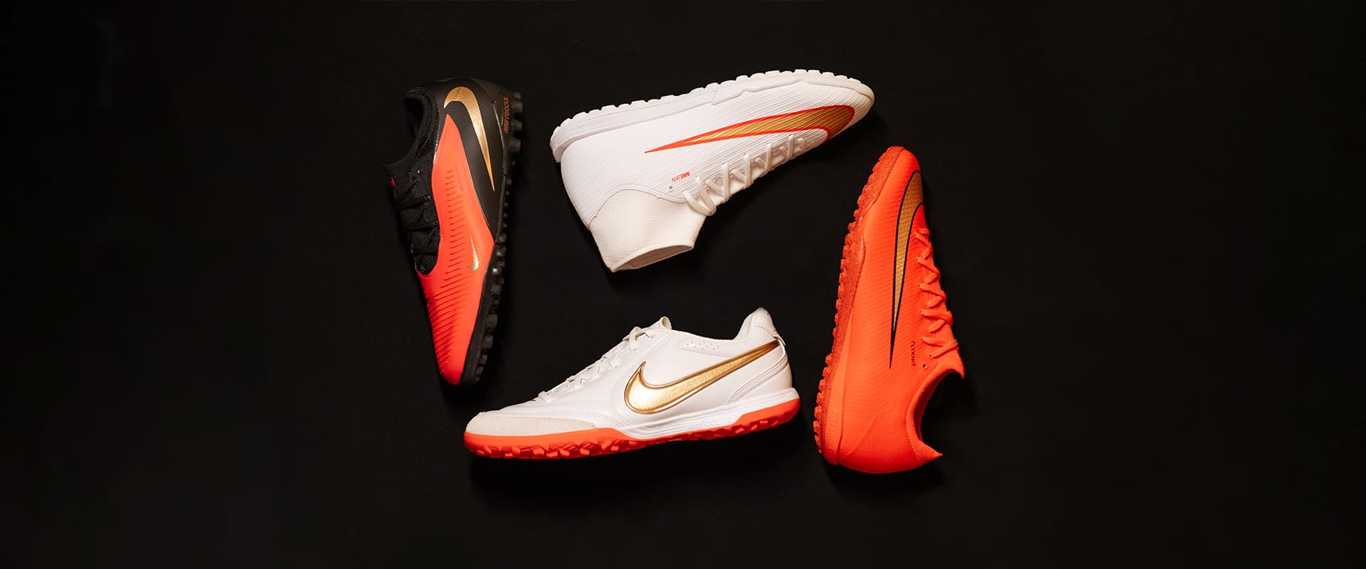 Nike football boot pack laid out on the pitch